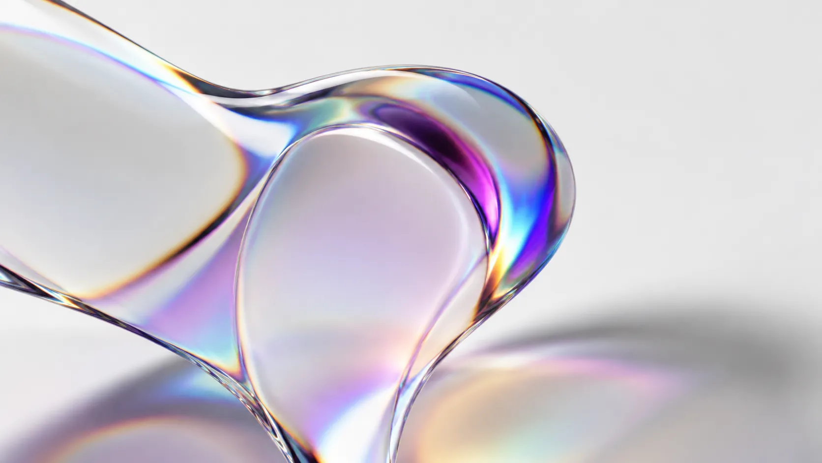 Liquid Glass design effect in Apple OS 27 shown as light refracting through glass surface