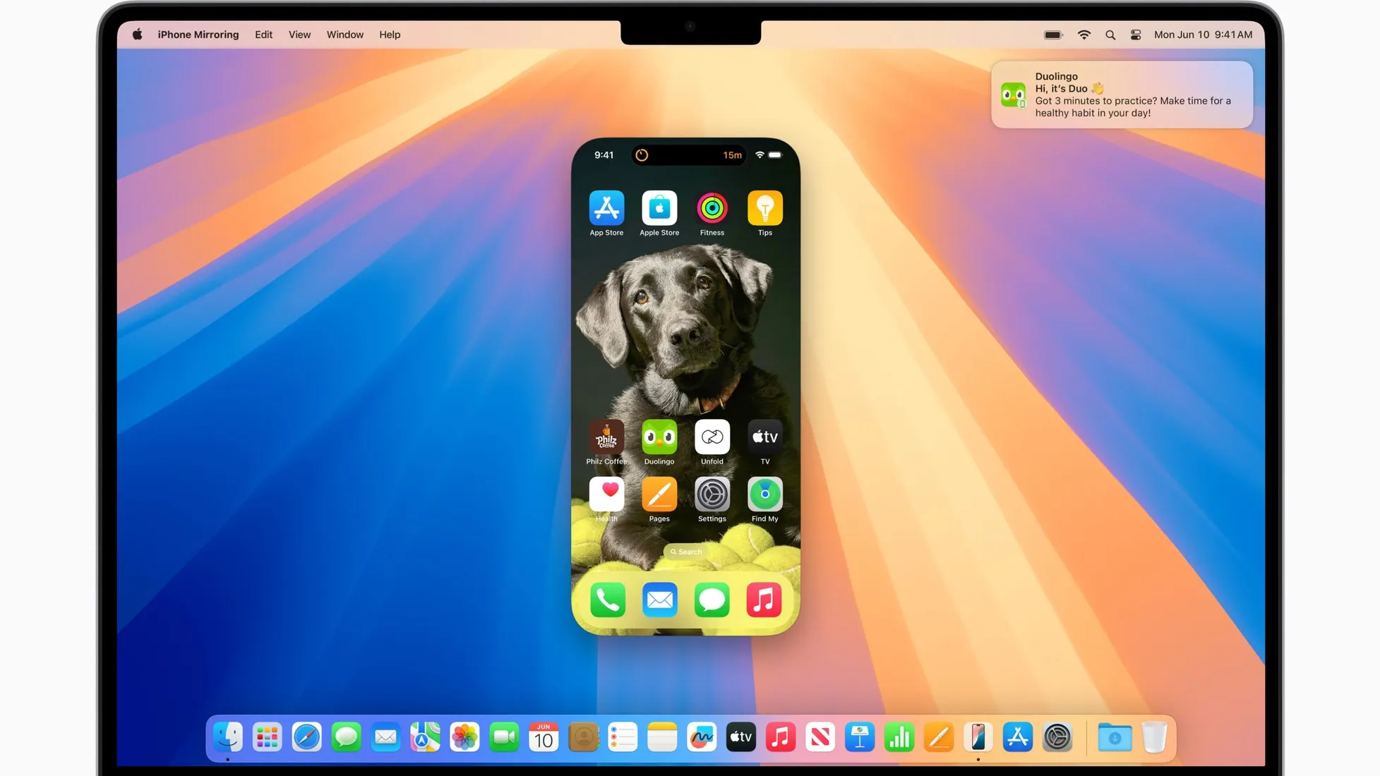iPhone Mirroring running on a Mac: the iPhone Home Screen appears in a window on the macOS desktop, the menu bar reads iPhone Mirroring, and an iPhone notification is delivered to the Mac in the top right corner